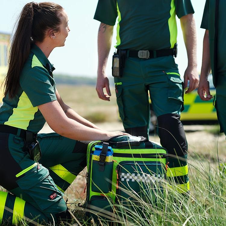 Emergency services professionals wearing ambulance trousers