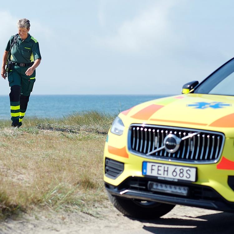 Ambulance staff by ambulance on the seaside