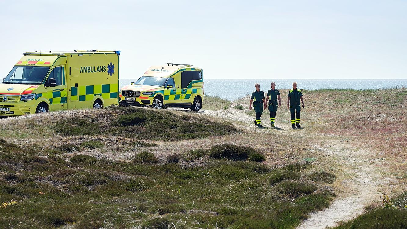 Ambulances and staff by the sea