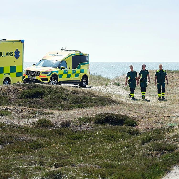 Ambulances and staff by the sea