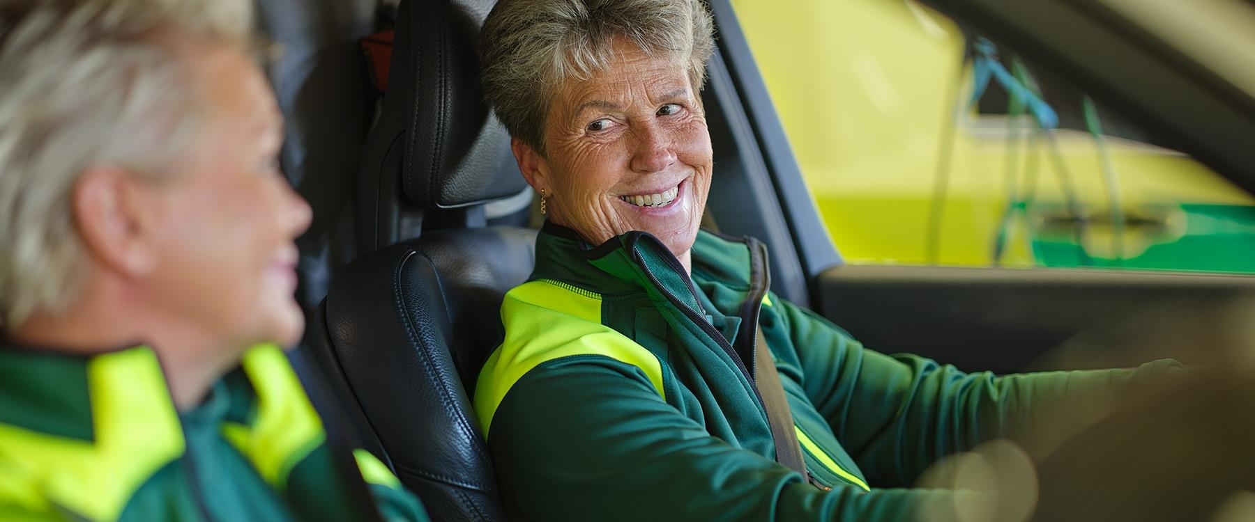 Female ambulance staff driving ambulance