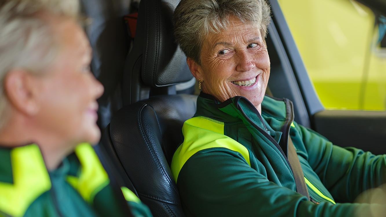 Female ambulance staff driving ambulance